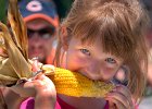 TWK 8517 BlueRidgeBBQFestival copy  Camryn Wolff, 6, of Lake Lure, eats roasted corn at the annual Blue Ridge BBQ Festival in Tryon, NC, Saturday afternoon, 6-9-07.